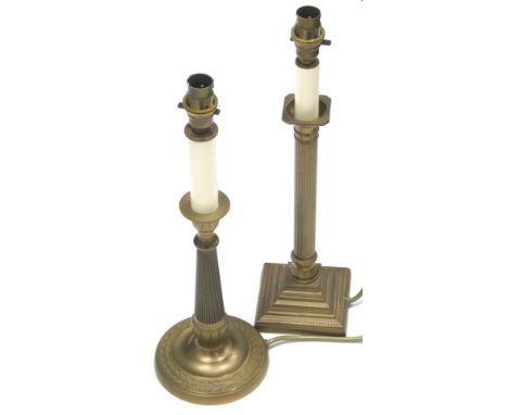 A pair of brass column candlestick lamps, each with square bases with modern electrical fittings,43cm high. (2)