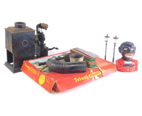 A collection of toys, to include a pair of early 20thC German miniature street lamps, a Tri-ang train set R3M, a money box an