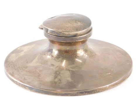 A George V silver capstan inkwell, of large proportion, the plain circular body on a weighted base, Birmingham 1925, 19cm dia