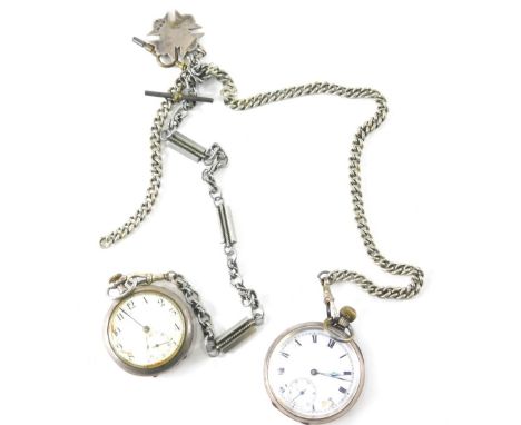 An early 20thC sterling silver open faced pocket watch, with 4cm Roman numeric dial, in an engine turned case, a further open