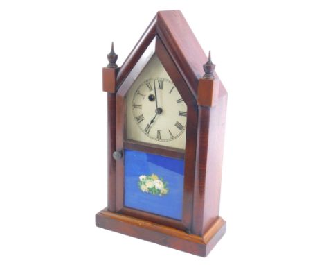 A 19thC Waterbury Clock Company American mantel clock, with an arched case, painted dial, etc., 38cm high.