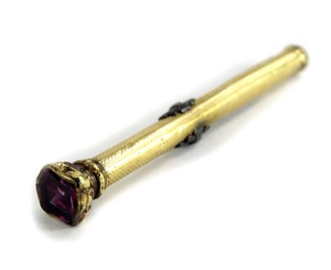 A Victorian 9ct gold pencil case, set with shield shaped single amethyst stone to top, with engine turned decoration and heav