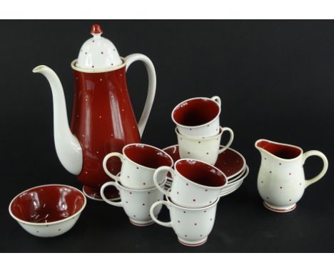 A Susie Cooper bone china part coffee service, decorated with red and white spots, to include coffee pot, milk jug, sugar bow