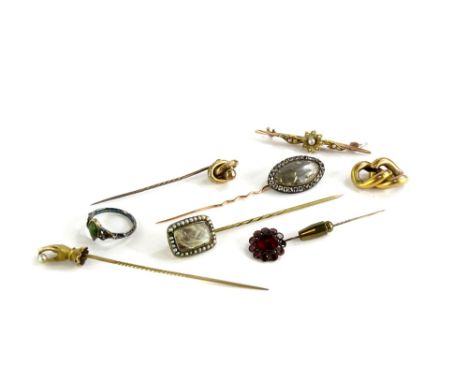 Various stick pins, comprising a stick pin with hand and cultured pearl, a Victorian memorial stick pin with lockets of hair 