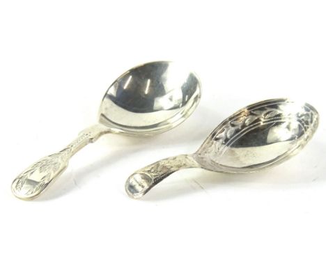 An Elizabeth II silver caddy spoon, each leaf engraved handle, Sheffield 1971 and a 19thC silver caddy spoons (2).