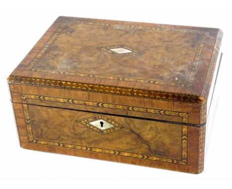 A Victorian walnut and parquetry jewellery box, the hinged lid with a tulip wood border and a vacant mother of pearl lozenge 