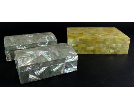 Three Eastern mother of pearl inlaid boxes, to include two similar, each with a domed lid.