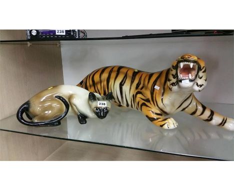 Ceramic tiger and a cat