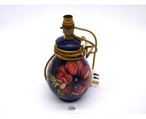 A Moorcroft lamp base having Anemone flower pattern, 10 3/4" tall.