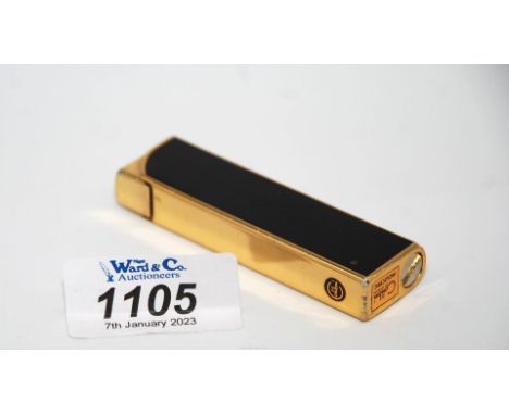 A Colibri cigarette lighter.