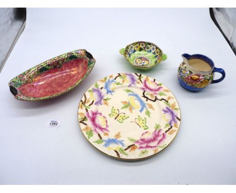 Four pieces of Maling china including 'Peony Rose' jug, display plate with raised floral and butterfly pattern, small green a