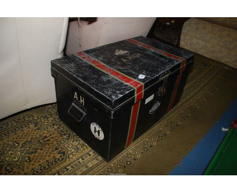 A vintage metal travelling Trunk with labels, 35'' x 21'' deep x 19 1/2'' tall.