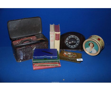 A quantity of miscellanea including Smith's Bakelite mantle clock, commemorative tins, books, shoe shine box, etc.