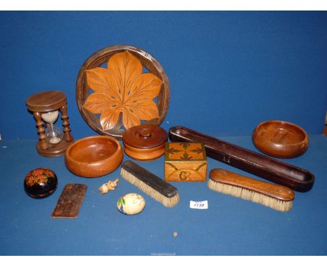 A quantity of treen including bowls, timer, clothes brushes, etc.