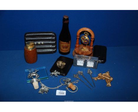 A quantity of miscellanea including a bottle of Coronation ale, wooden lighter, modern bottle stoppers, cigar cutter and hold