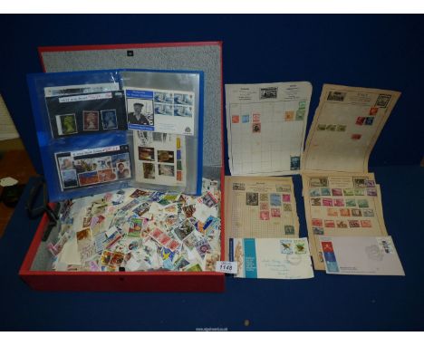 A box file of loose World stamps, First edition covers, etc.