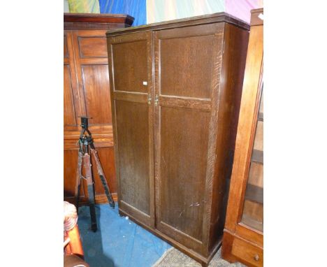 A 'Verithing' dark oak doored Wardrobe, the interior nicely fitted out with labelled compartments and drawers for handkerchie