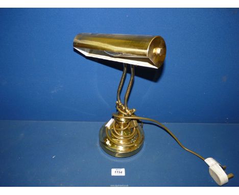 A brass Desk Lamp.