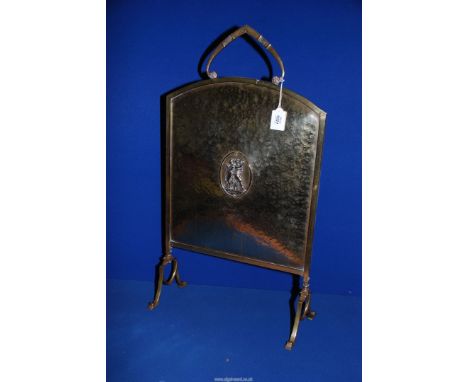 A late 19th c. Art Nouveau brass Fireguard with an oval in the centre with a depiction of musicians, 32'' x 17''.