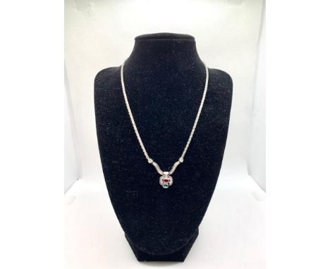 NECKLACE IN 18 18-CARAT WHITE GOLD, 16 GRAMS BRILLIANT-CUT DIAMONDS FOR TOTAL 0.63 CARATS RUBY 0.5 CARATS, EMERALD 0.5 CARATS