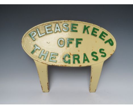 A VINTAGE HEAVY CAST METAL 'PLEASE KEEP OF THE GRASS' PAINTED SIGN, oval form with two struts for display purpose, approximat