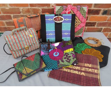 A COLLECTION OF MOSTLY AFRICAN  VINTAGE AND MODERN TEXTILE BAGS, various styles and periods to include a retro style briefcas