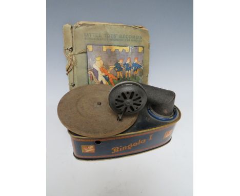A VINTAGE TINPLATE BINGOLA I RECORD PLAYER, together with a selection of 'Little Tots' records, L 22 cm, W 16 cm, H 14 cm