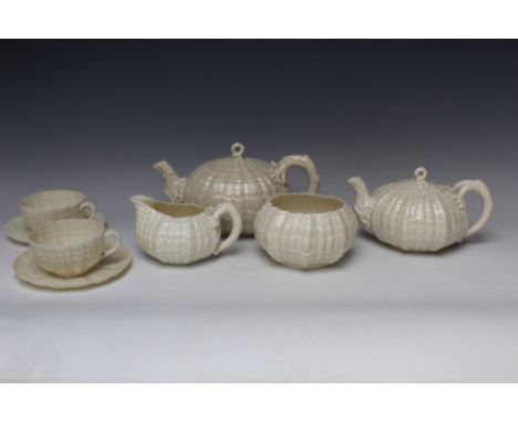 A BELLEEK EIGHT PIECE TEA SERVICE, comprising large and small teapot, cream jug and sugar bowl and two cups and saucers, all 