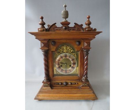 A MAHOGANY CASED HAC MANTLE CLOCK, having an architectural case and barley twist pillars, the brass break arch dial plate hav