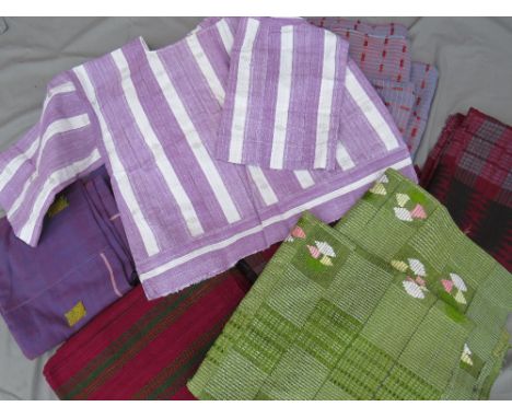 A COLLECTION OF FIVE MID CENTURY&nbsp;&amp; LATER&nbsp; AFRICAN 3 PC WRAPPERS / FABRIC PANEL SETS, together with a three piec