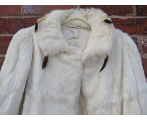 A VINTAGE ERMINE FUR CAPE, with attached tails to the collar, fully lined