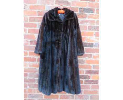 A VINTAGE DARK CHOCOLATE BROWN FULL LENGTH MINK FUR COAT RETAILED BY HARRODS, fully lined, internal ties, hook fastenersCondi