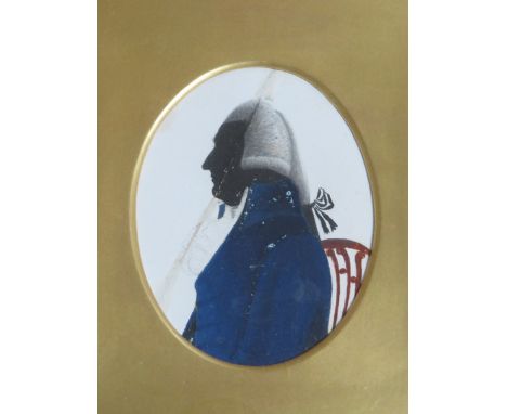 A LATE 19TH / EARLY 19TH CENTURY OVAL PORTRAIT MINIATURE SILHOUETTE OF A SEATED NAVAL GENTLEMAN, unsigned, mixed media on pap