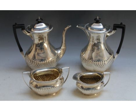 A HALLMARKED SILVER FOUR PIECE DEMI FLUTED TEA SERVICE BY JOHN &amp; WILLIAM F DEAKIN - SHEFFIELD 1896. approx combined weigh