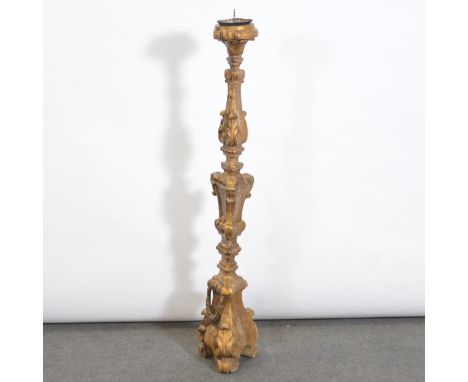 Italian style gilt painted ‘altar candlestick’, triform section, swags and foliage, height 130cm.