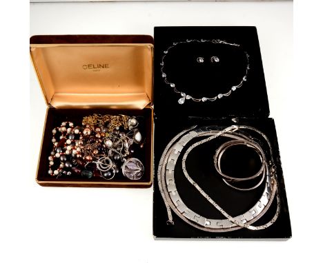 A collection of silver and costume jewellery, pearl necklaces, three silver collars, a Lily design torque bangle, a half hing