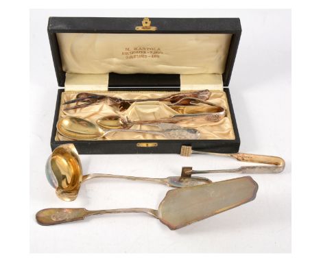 A white metal ladle, Michael Kantola, Turku 1921, fineness mark 813H, gilded bowl; cake slice; ice tongs; sugar tongs; two pi