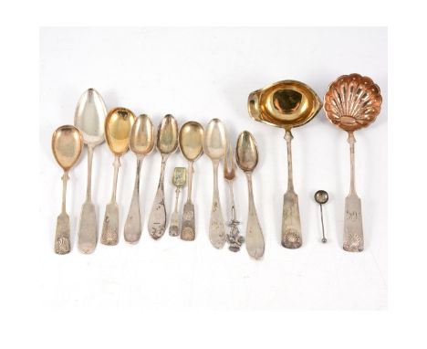 A white metal ladle, Finnish hallmarks for SKK Oy, Turku 1923, gilded bowl; a white metal sugar sifter spoon, SKK Oy, Turku, 