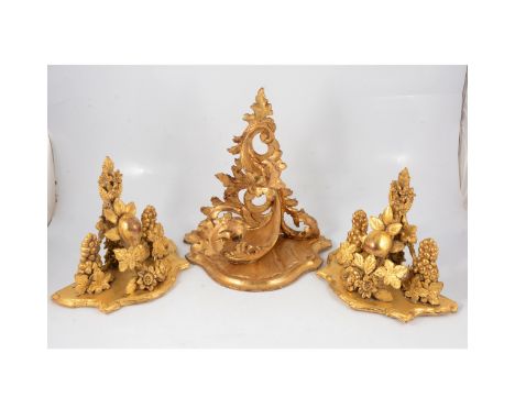Florentine style gilt wood bracket, designed with scrolling acanthus, 32cm; and a pair of gilt brackets, decorated with fruit