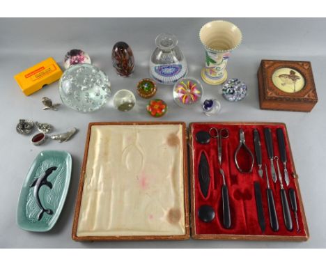 A mixed  group including paperweights, a 1920's Poole pottery trumpet vase and other items  