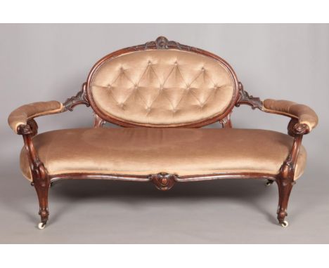 A Victorian carved mahogany parlour sofa.  