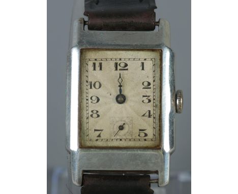 A gentlemen's silver manual wristwatch.  Missing a minute finger.  Does not keep time.