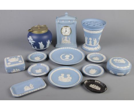 A quantity of blue Wedgwood jasperware. Including mantel clock, vase, trinket boxes &amp; dishes, etc.  
