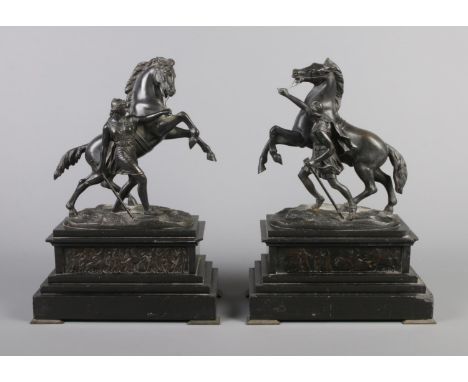 Graux Marly Foundry, a pair of bronze Marly Horses raised on slate plinths. Signed. 32cm.  Bronzes appear good. Various chips