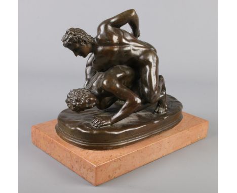 After Tupton, a bronze sculpture, The Wrestlers, raised on marble plinth. 23cm.  