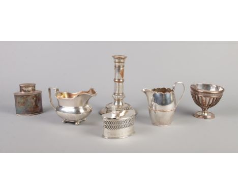 Six pieces of Georgian Sheffield plate. Includes two cream jugs, candlestick, tea caddy, bowl and mustard pot.  