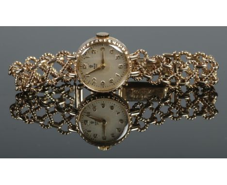 A ladies 9ct gold Tudor Royal manual wristwatch on 9ct gold Rolex bracelet strap. Gross weight 19.06g.  Does not wind.
