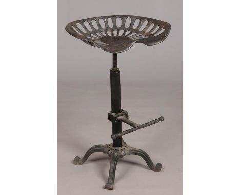 An industrial style cast iron swivel chair with tractor seat.  