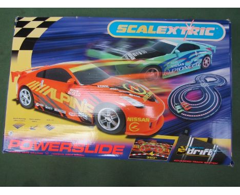 A Scalextric Powerslide set with Nissan 350Z cars