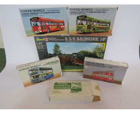 Four Tower Models 1/76 scale bus and tram plastic model kits and another together with a Revell S 3/6 Baureihe locomotive 1/8